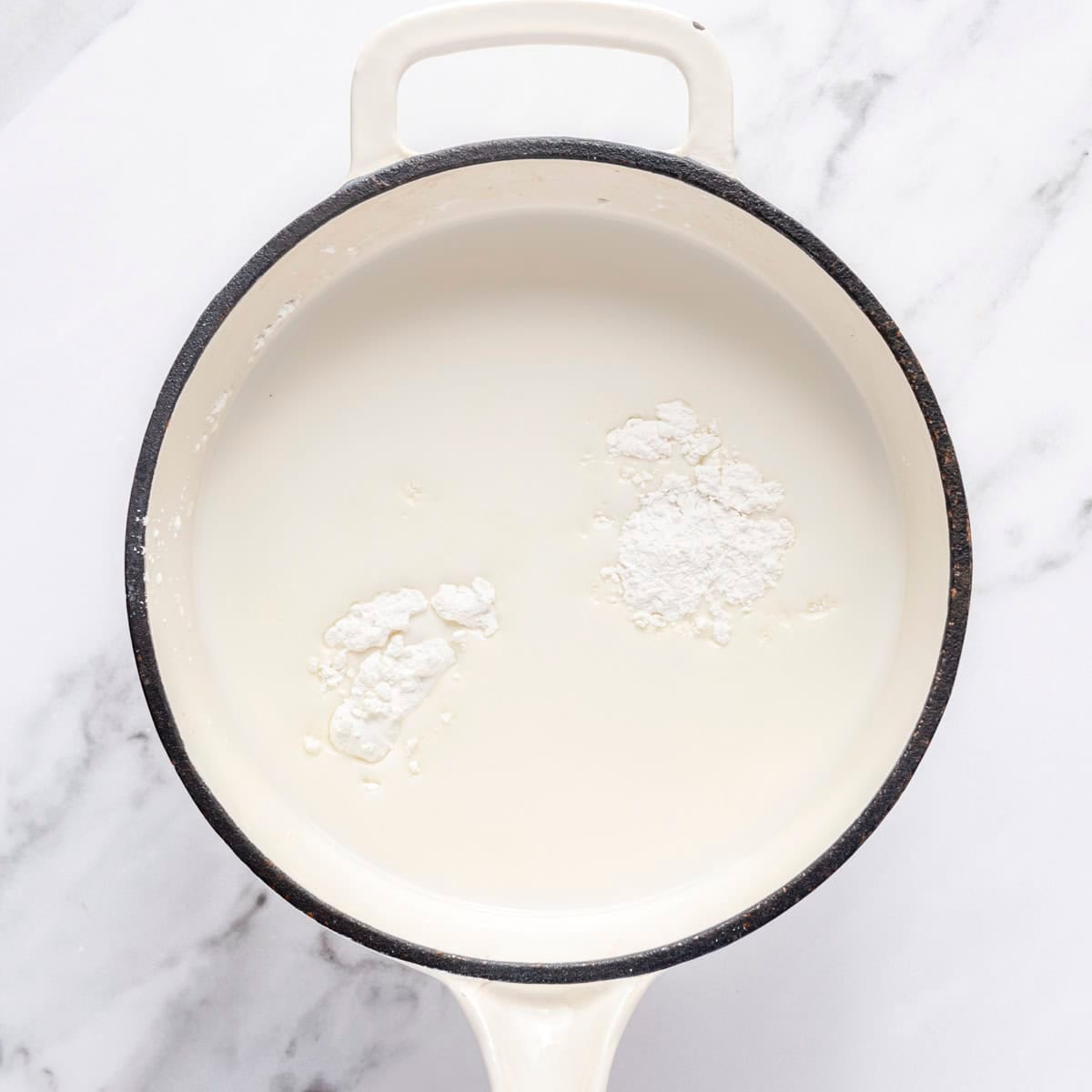 Milk, sugar and cornstarch in a saucepan.