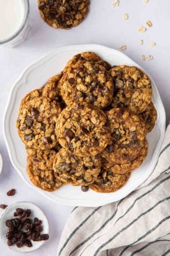 Oatmeal chocolate chip raisin cookies on a plate.