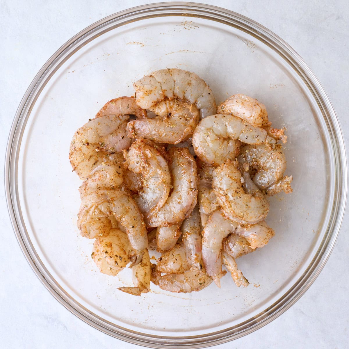 After tossing shrimp in oil and seasonings.