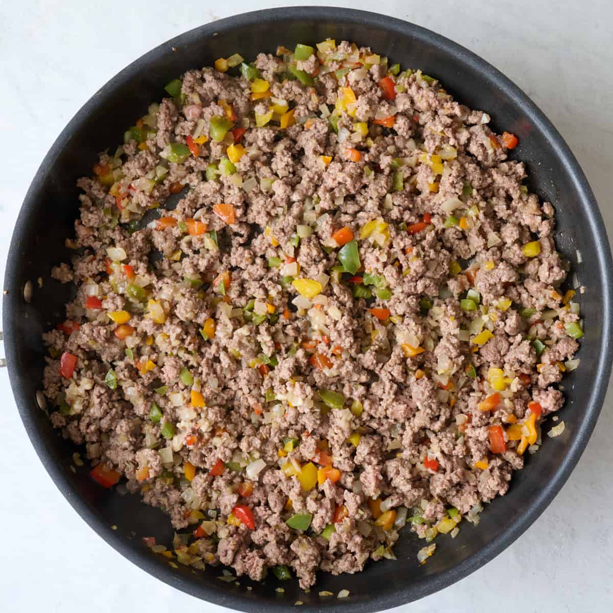 After beef is crumbled and browned garlic cooked in.