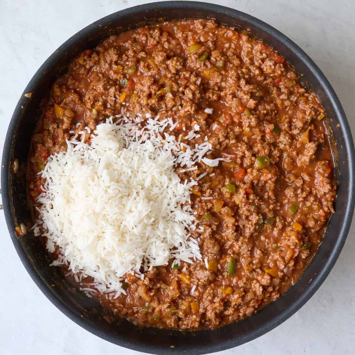 Meat sauce after thickened with cooked rice added.
