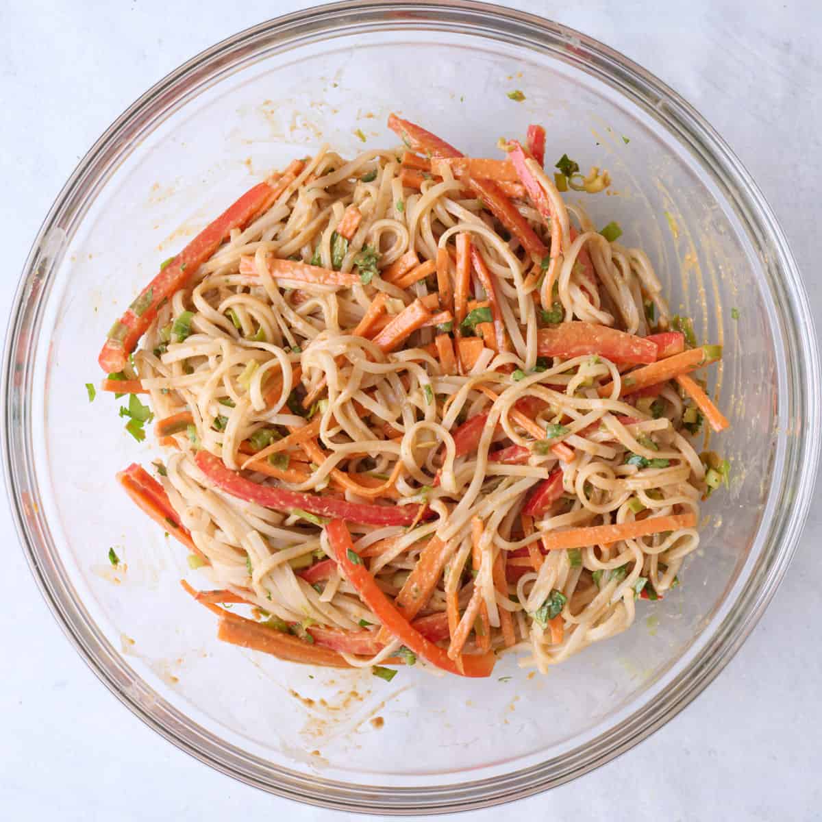After tossing dressing with salad ingredients.