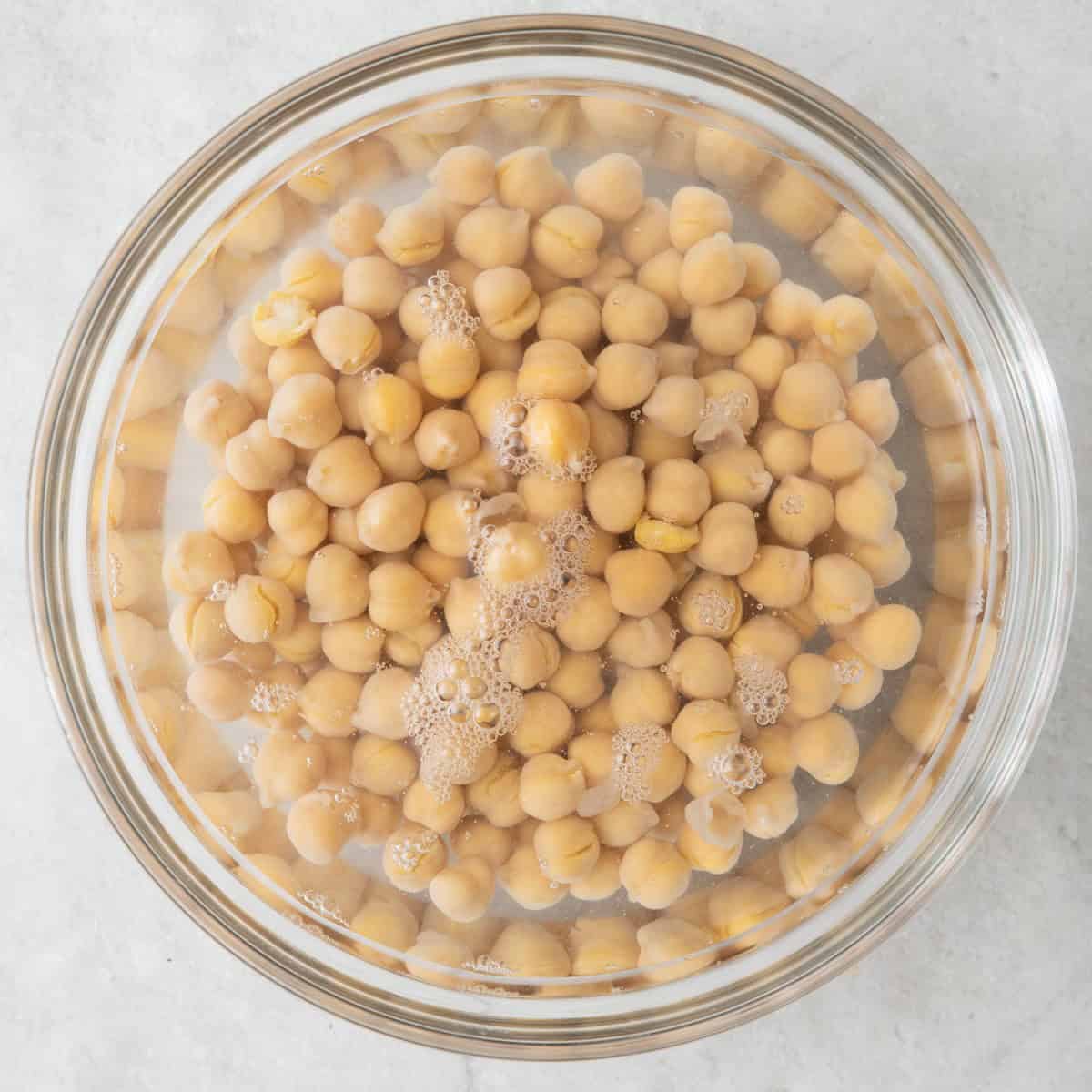 Chickpeas soaking in water.