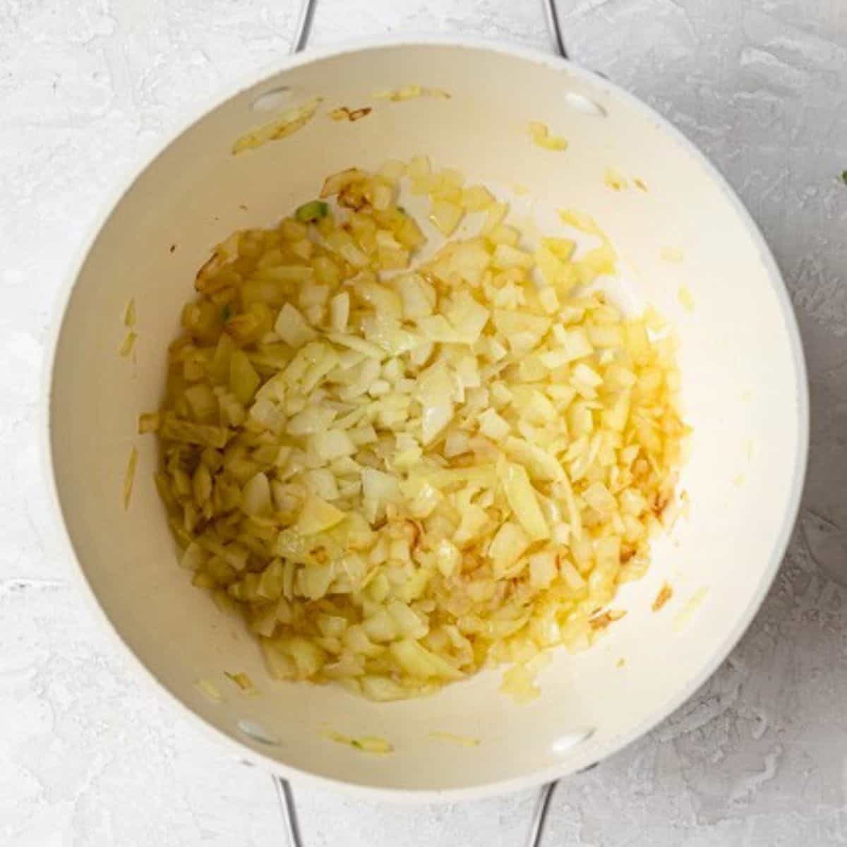 Diced onions in a pot after cooking.
