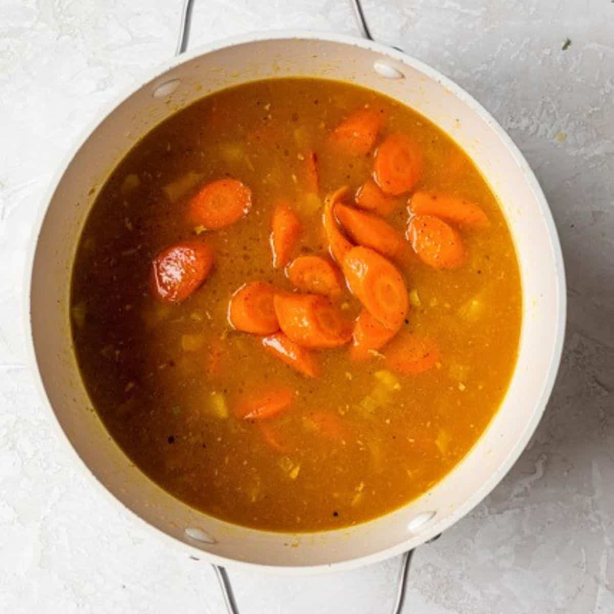 Roasted carrots added to soup base.