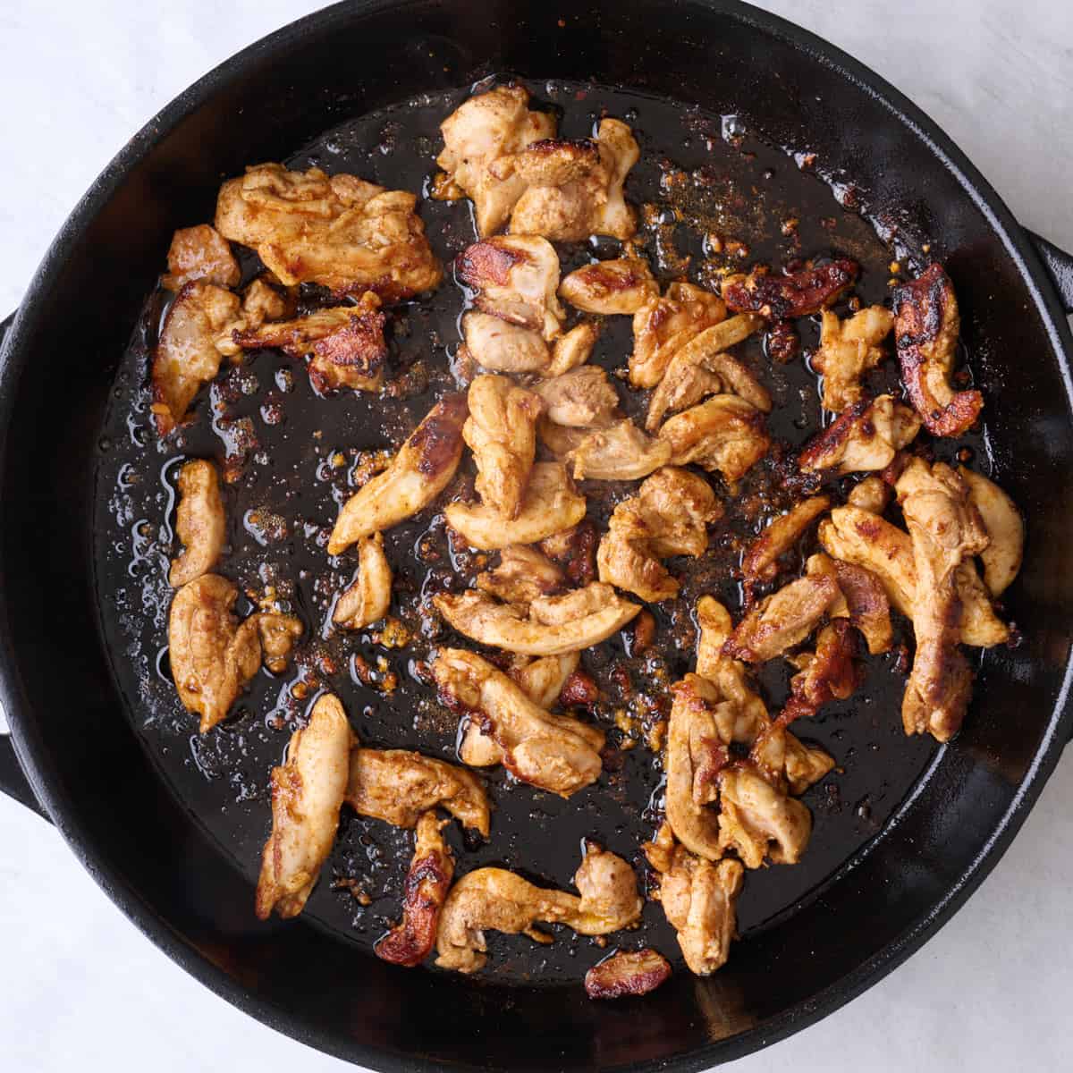 After chicken is browned and cooked through.