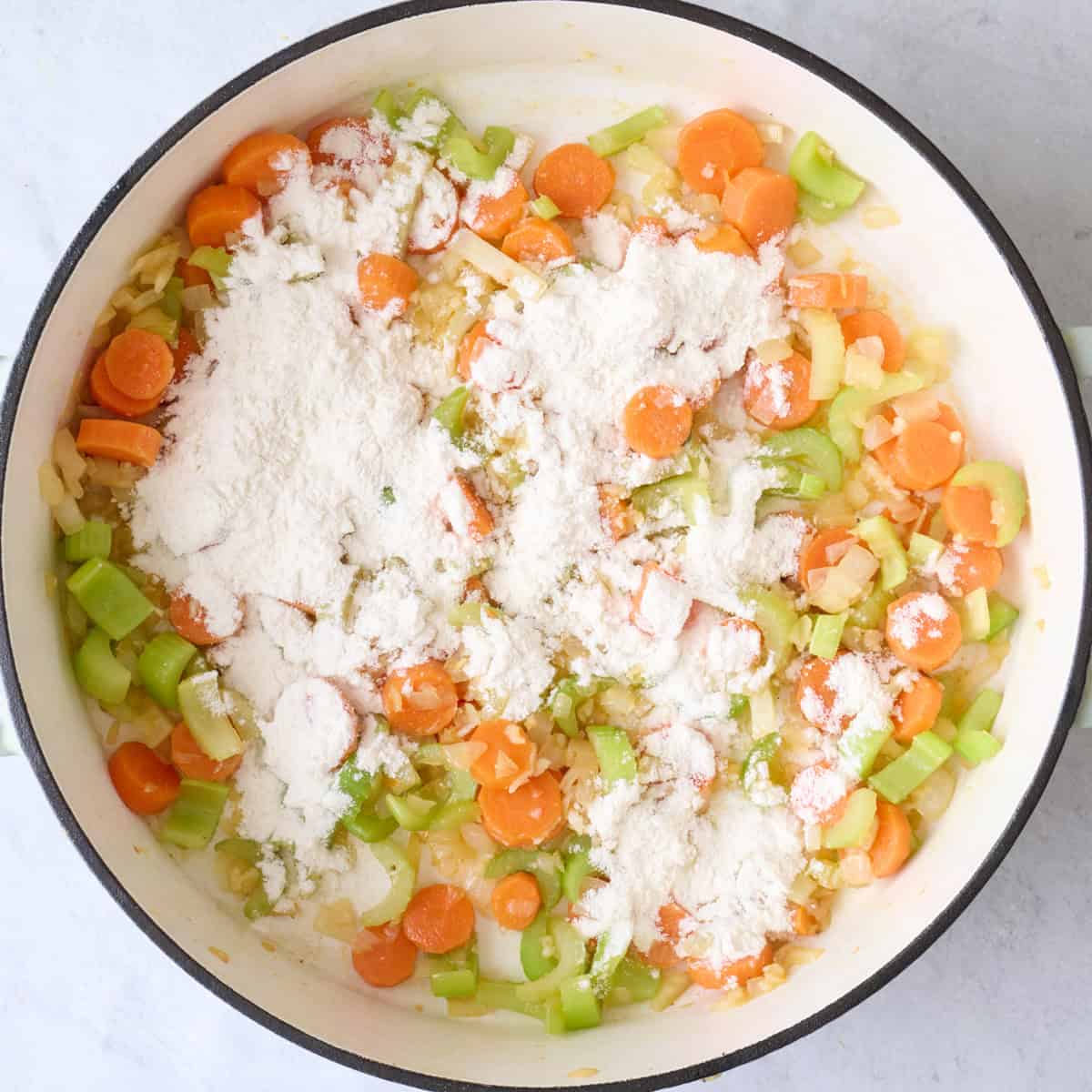 After cooking garlic with flour sprinkled on top of cooked vegetables.