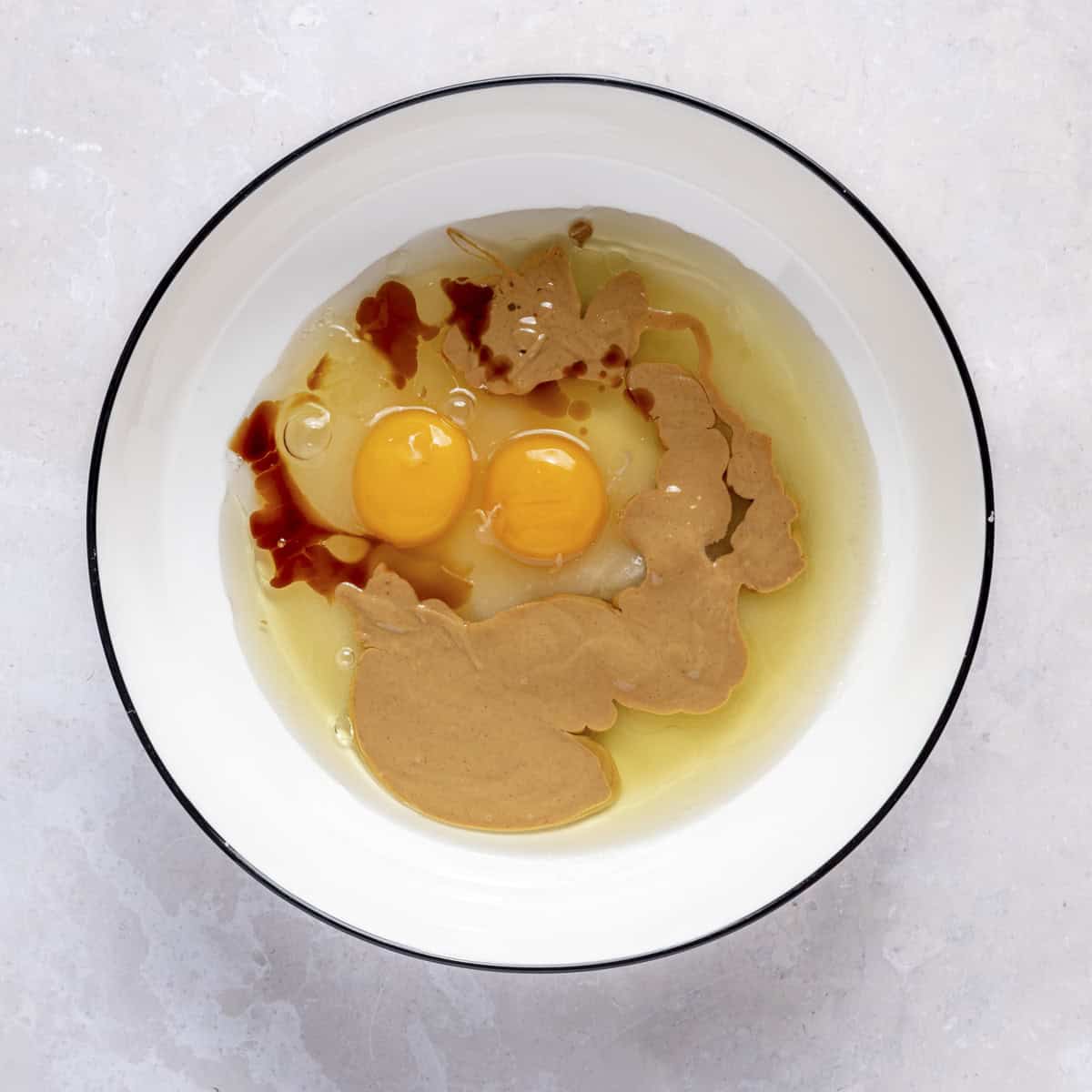 Eggs, sugar, oil, peanut butter and vanilla in a large bowl.