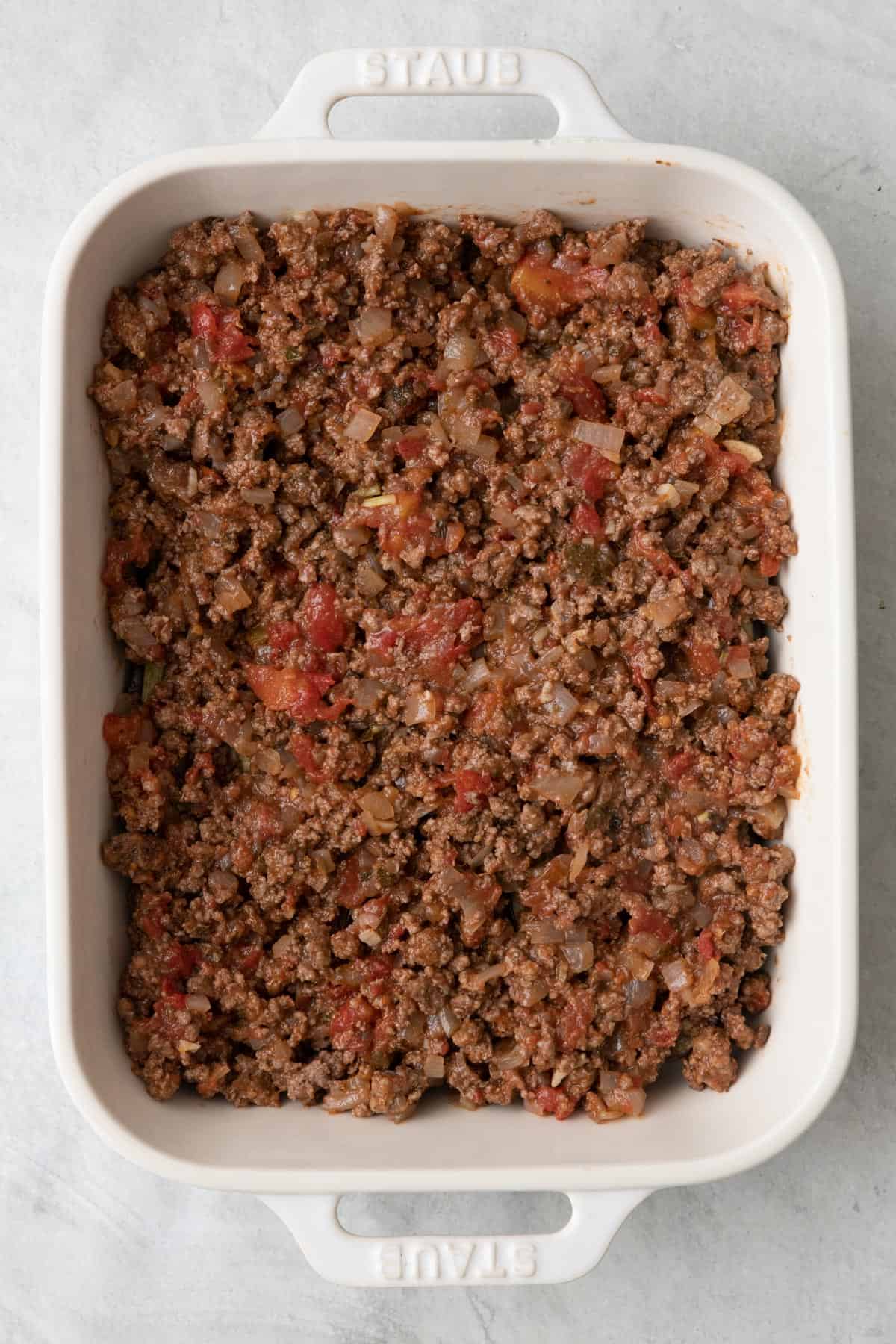 Meat sauce spread over top of eggplant.