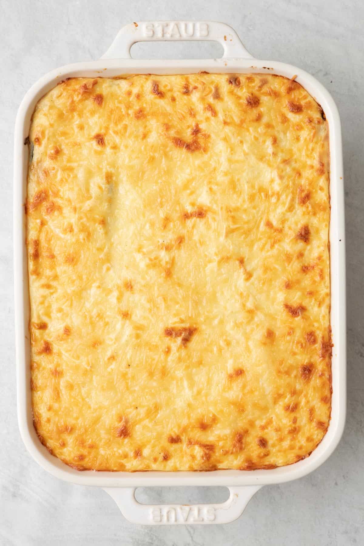 Moussaka after baking with a melty, golden brown cheese top.