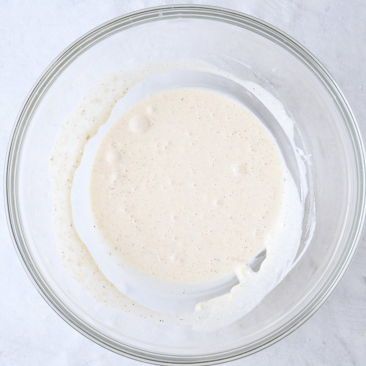 After whisking together dressing in a bowl.