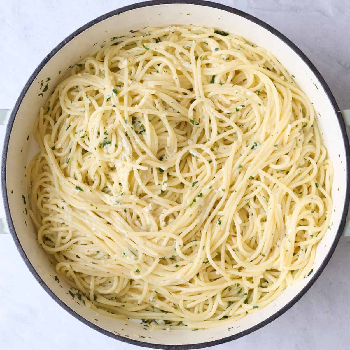 After tossing pasta with sauce and cheese.