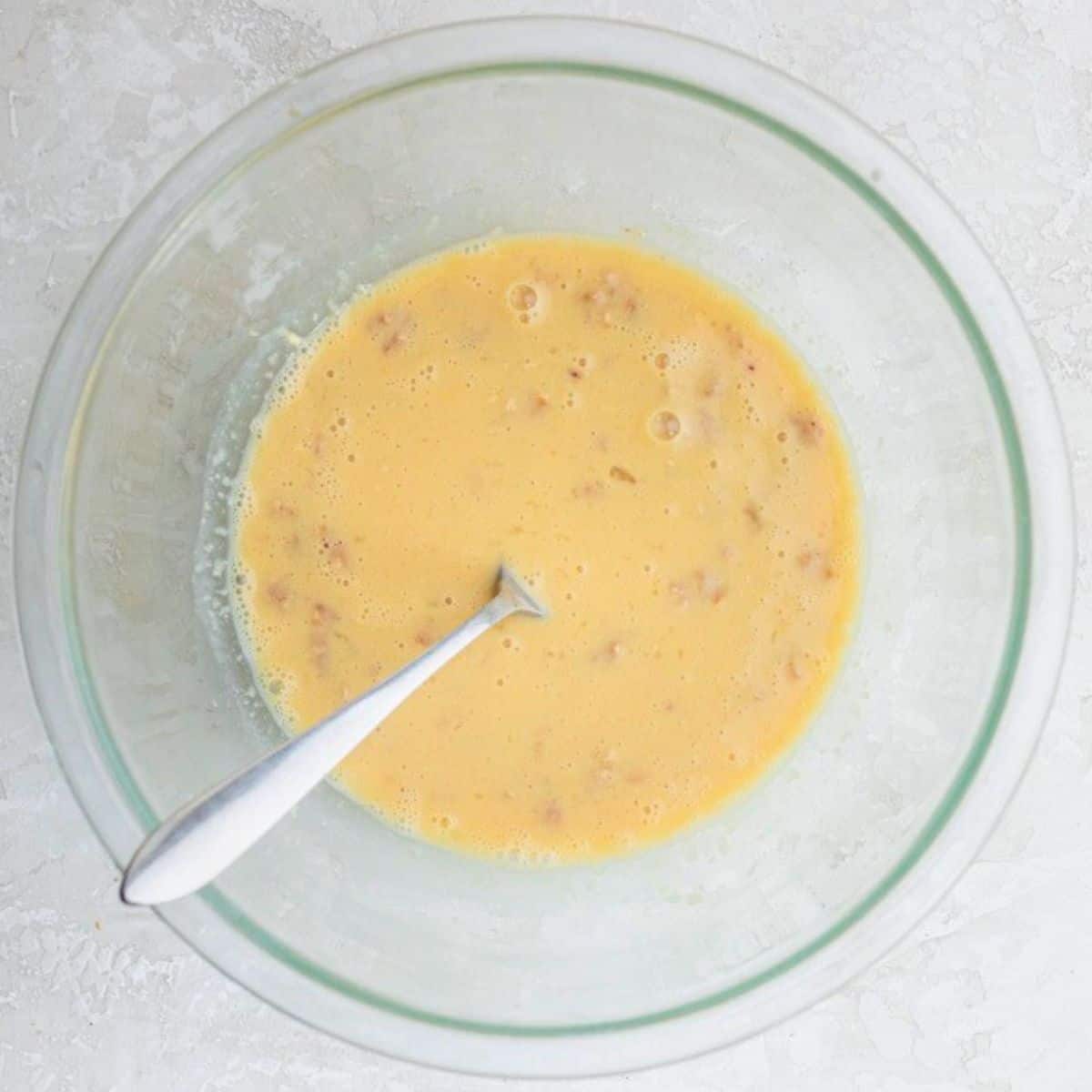 After whisking wet ingredients together in bowl.