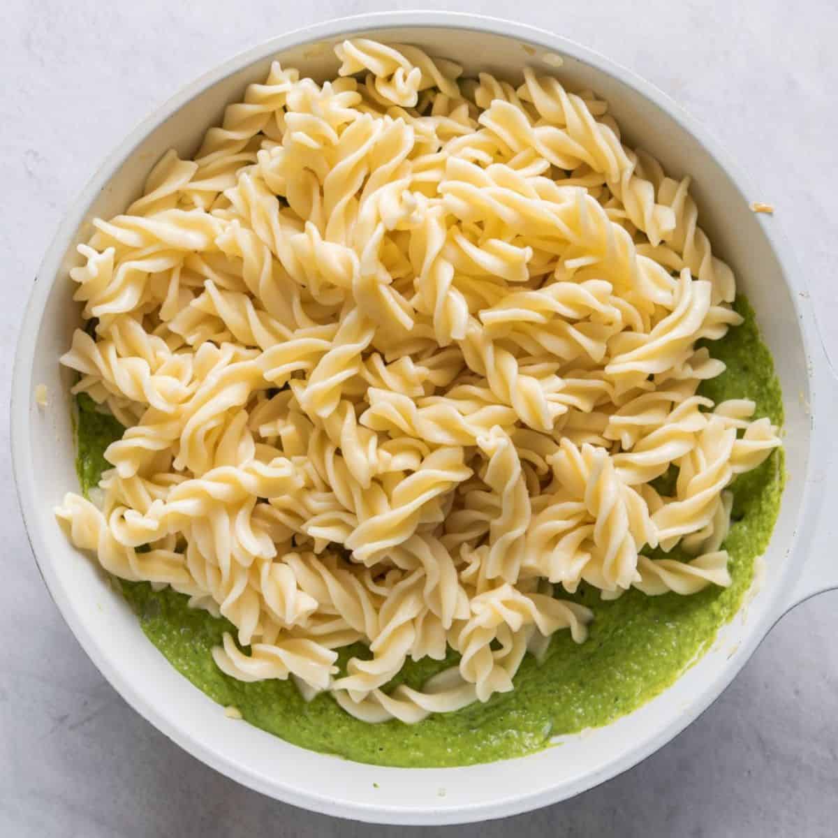 Cooked pasta added to sauce.