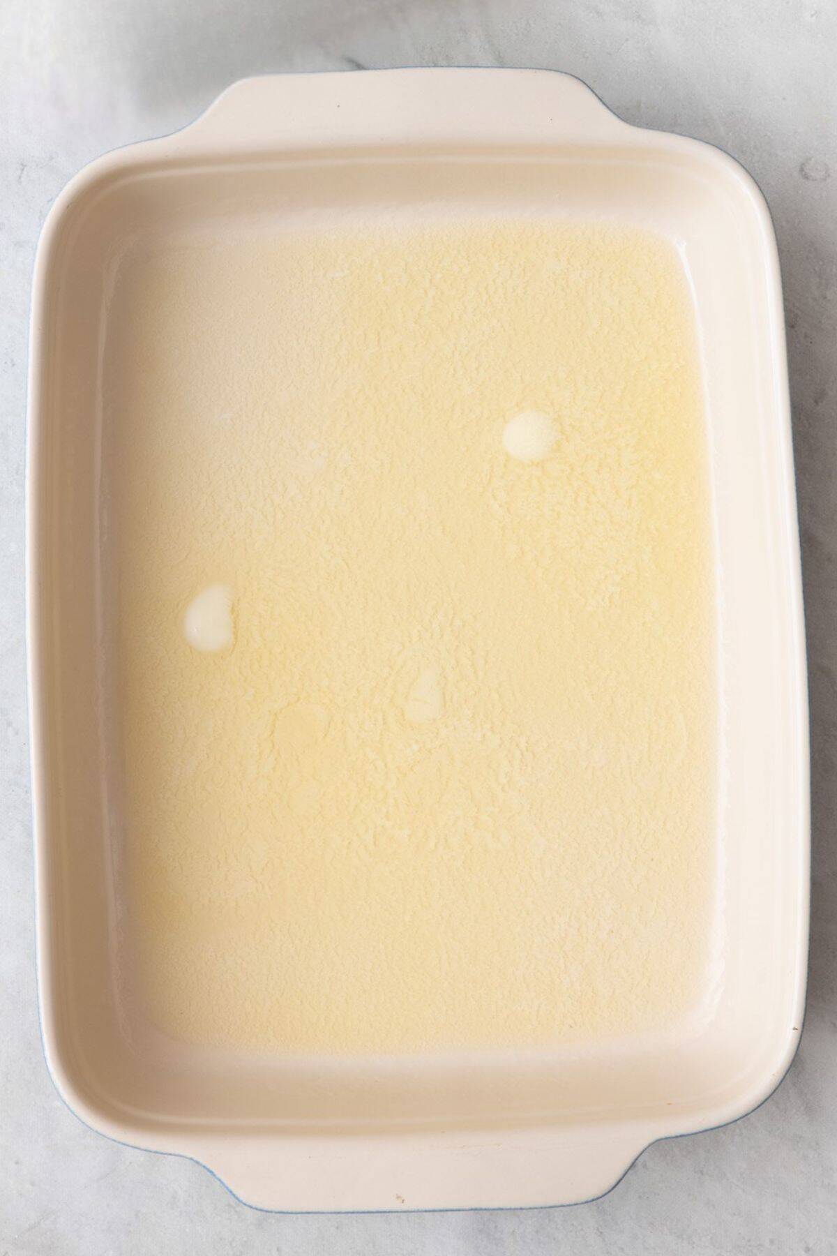 Melted butter in baking dish.