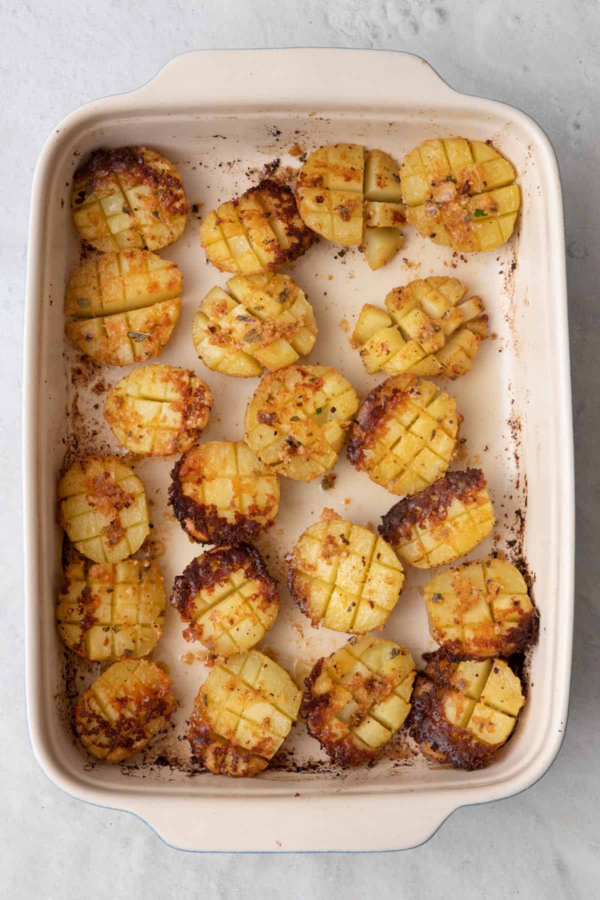 Recipe after baking and potatoes are flipped to show crispy cheese crust.