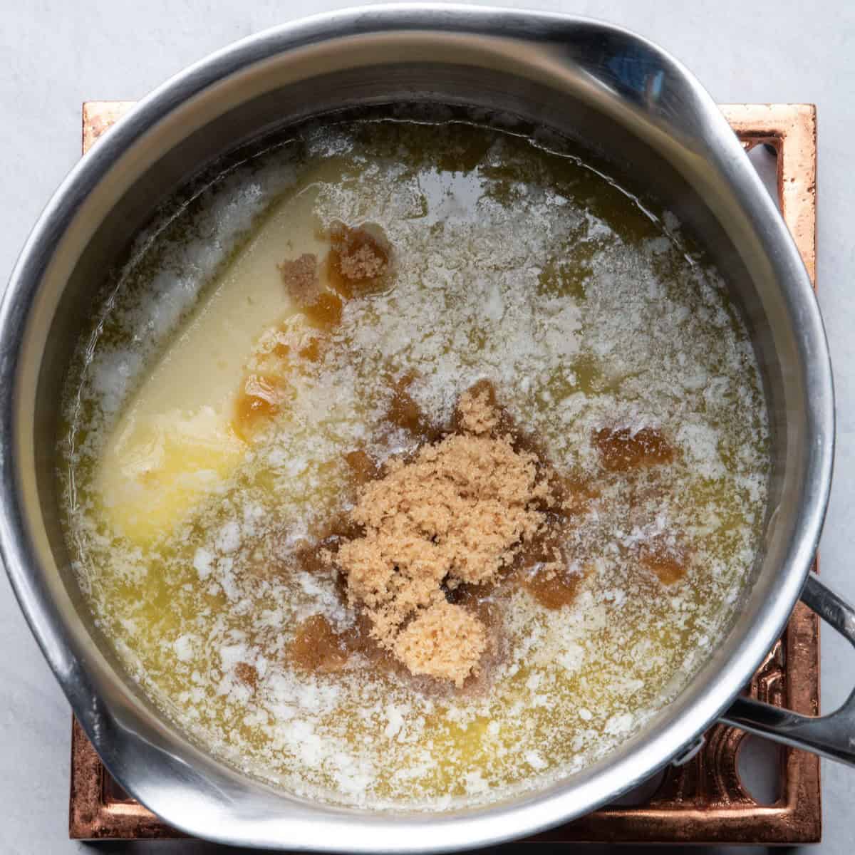 Butter and brown sugar in a pot.