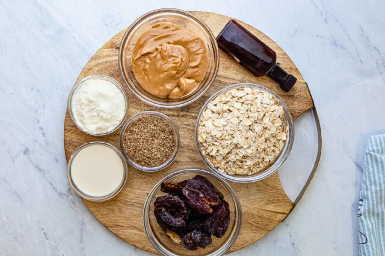 Ingredients for recipe: oats, peanut butter, dates, almond milk, vanilla, protein powder, ground flaxseed.