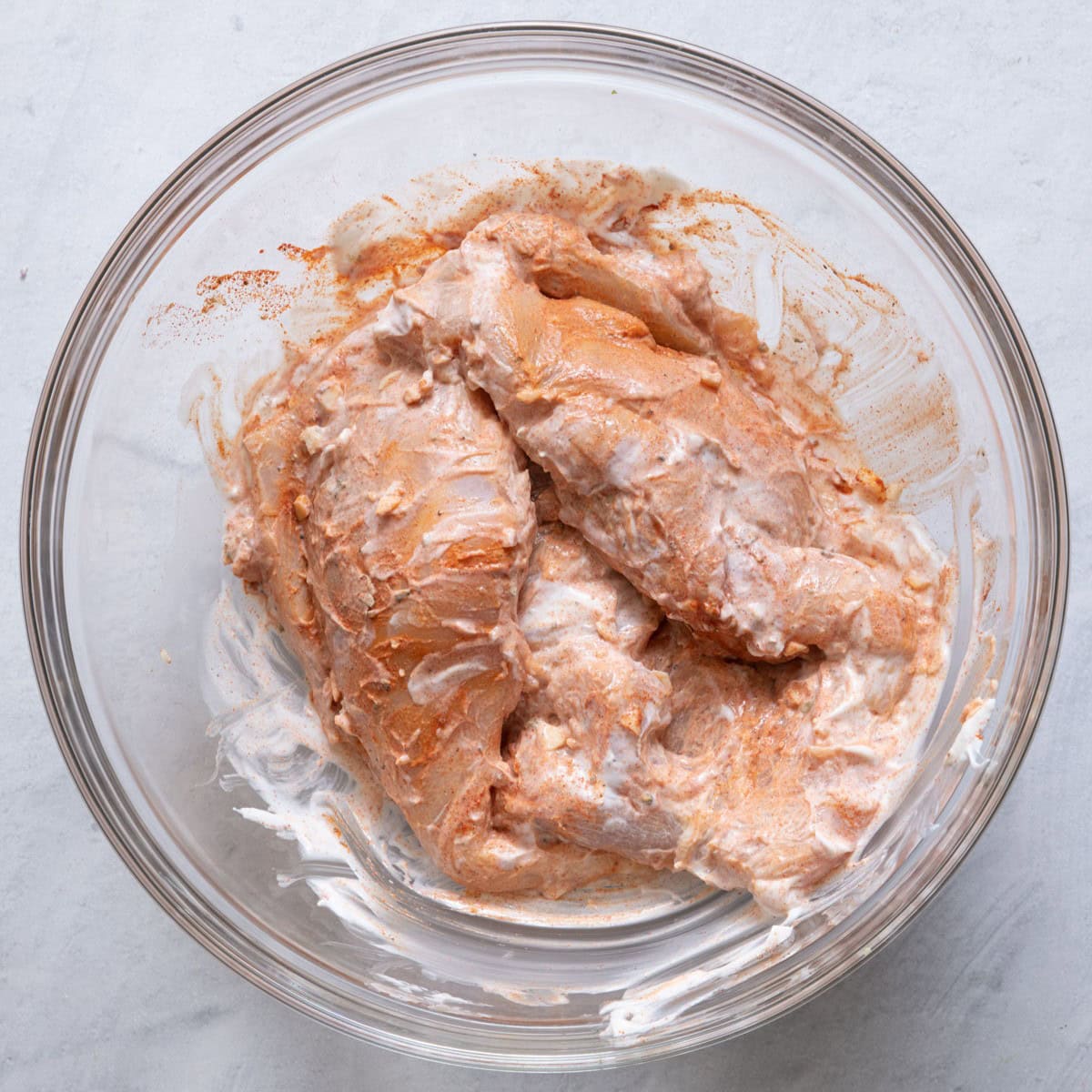 Yogurt and seasoning rubbed well into chicken.