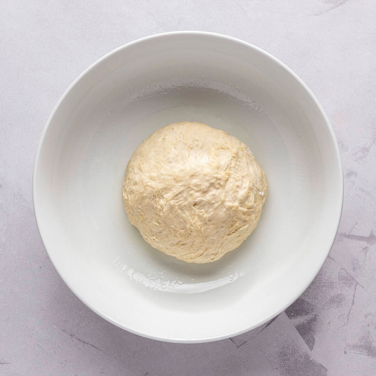 After kneading into a soft ball and placed in an oiled bowl.