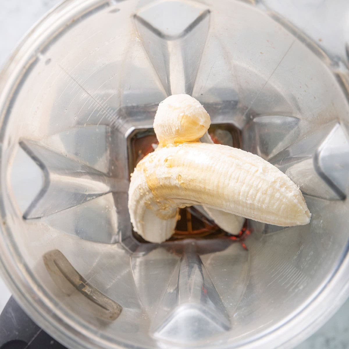 Banana and maple syrup in a blender.