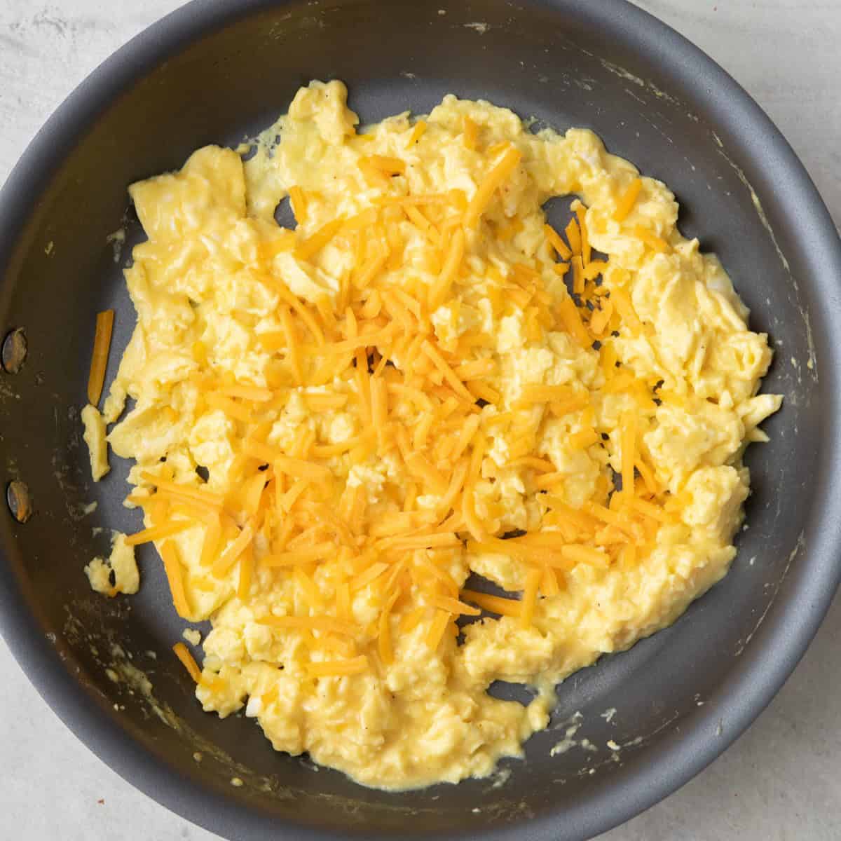 Eggs after completely cooked with cheese added.