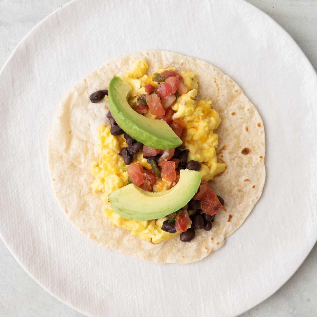 After topped with salsa, beans, and avocados.
