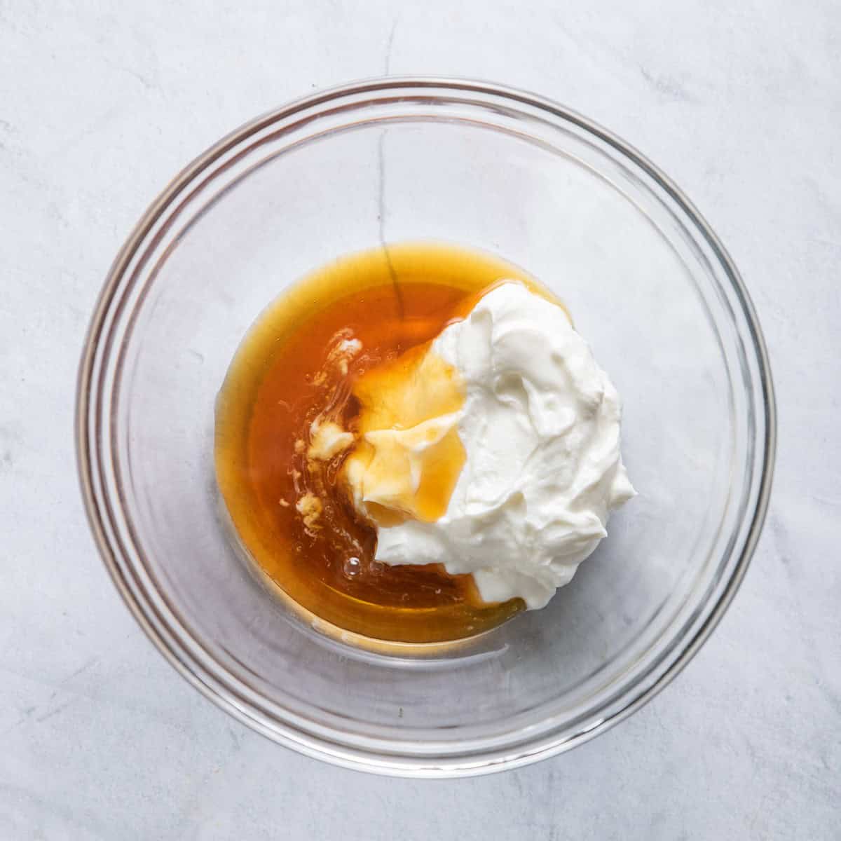 Yogurt and honey in a bowl.