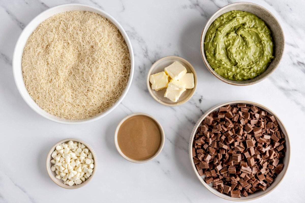 Ingredients to make recipe: shredded kaitaifi (phyllo dough), white chocolate chips, tahini, butter, pistachio butter, and chopped milk chocolate bar.