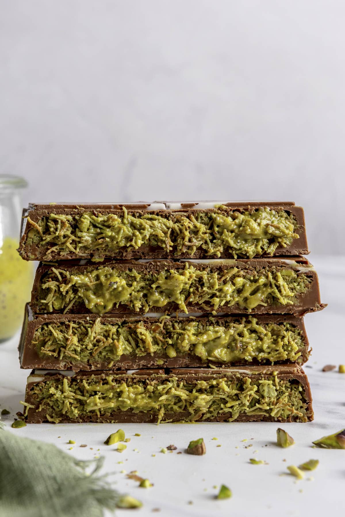 Dubai chocolate bar stacked up to show inside pistachio and kaitaifi filling.