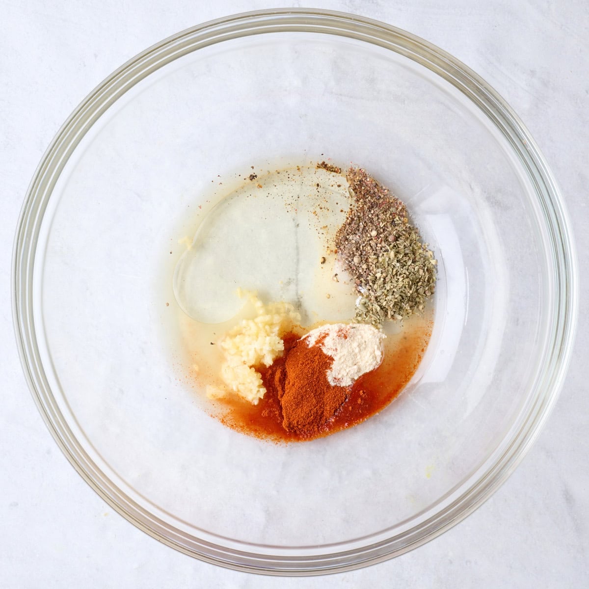 Marinade ingredients in a bowl before mixing.
