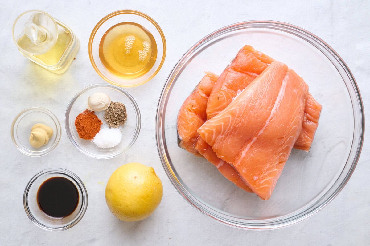 Ingredients for recipe: skin on salmon fillets, oil, honey, soy sauce, lemon, Dijon mustard, and spices.