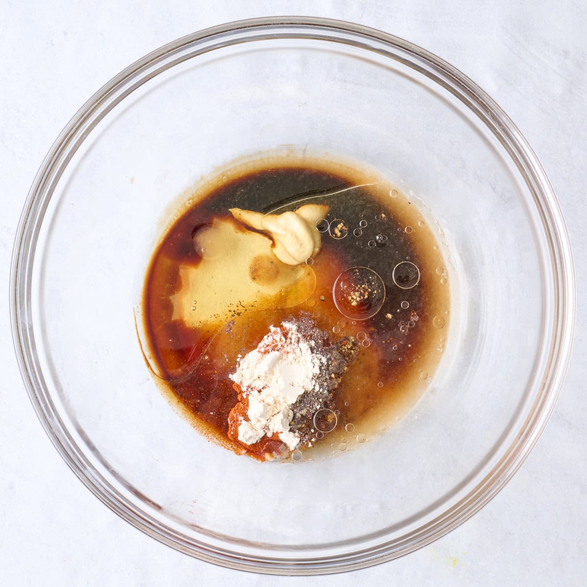 Marinade ingredients in a bowl before combining.