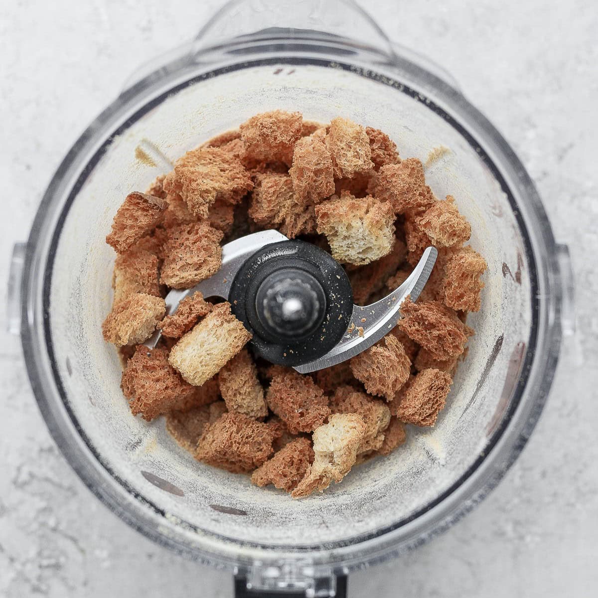 Croutons in a food processor.