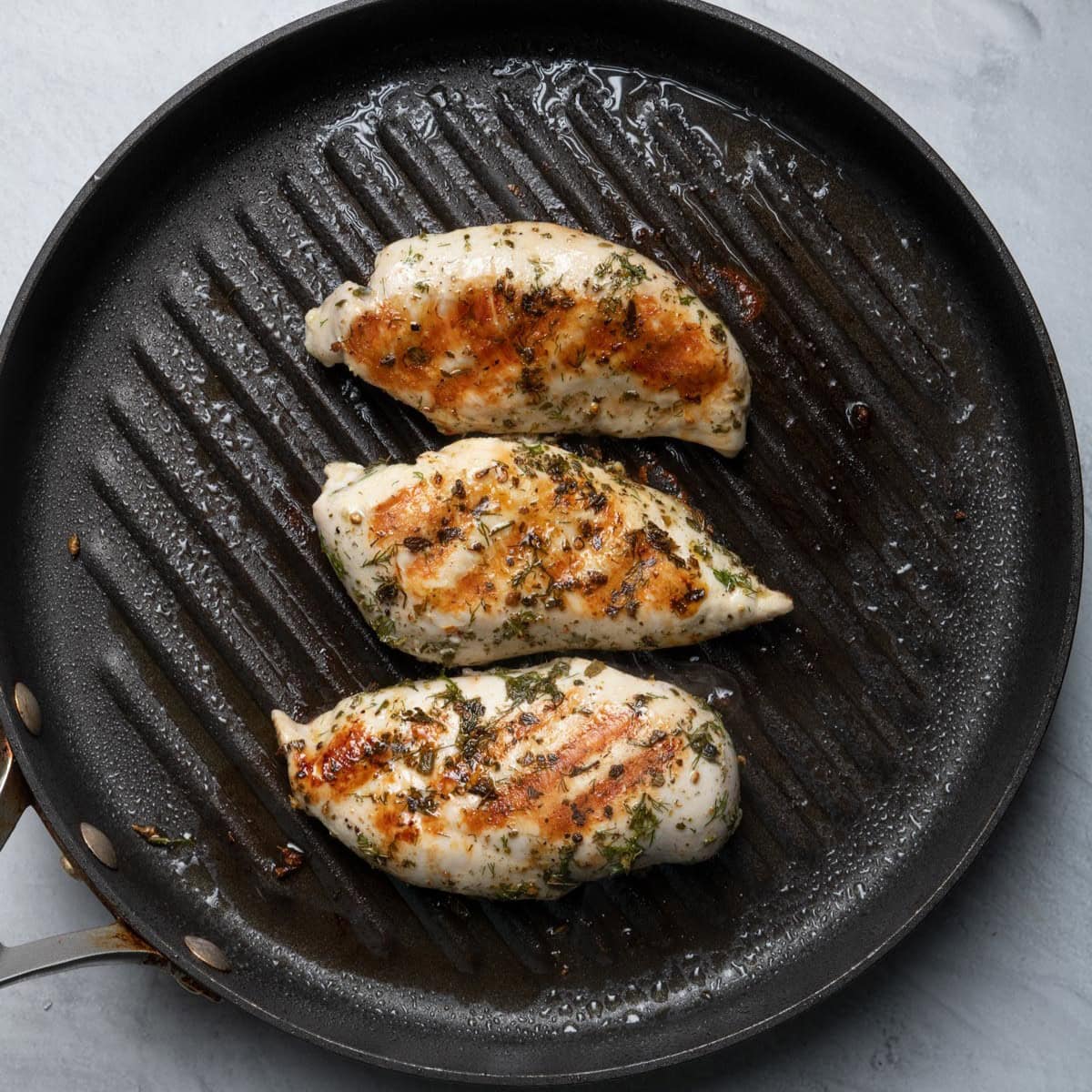 Chicken on grill pan after cooking.