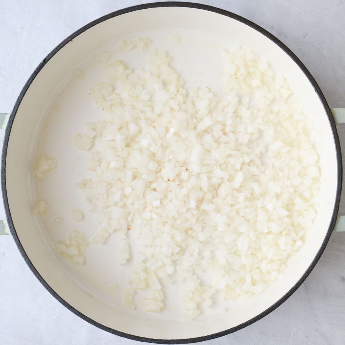 Diced onions in a oiled pot.