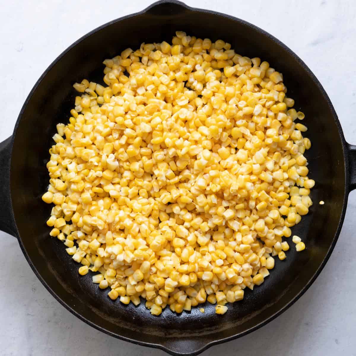 Corn on skillet before cooked.