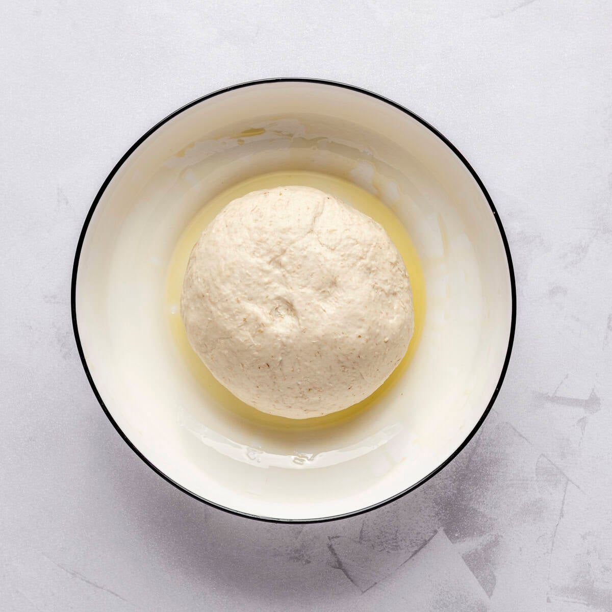 After kneading until smooth and in an oil coated bowl, before rising.