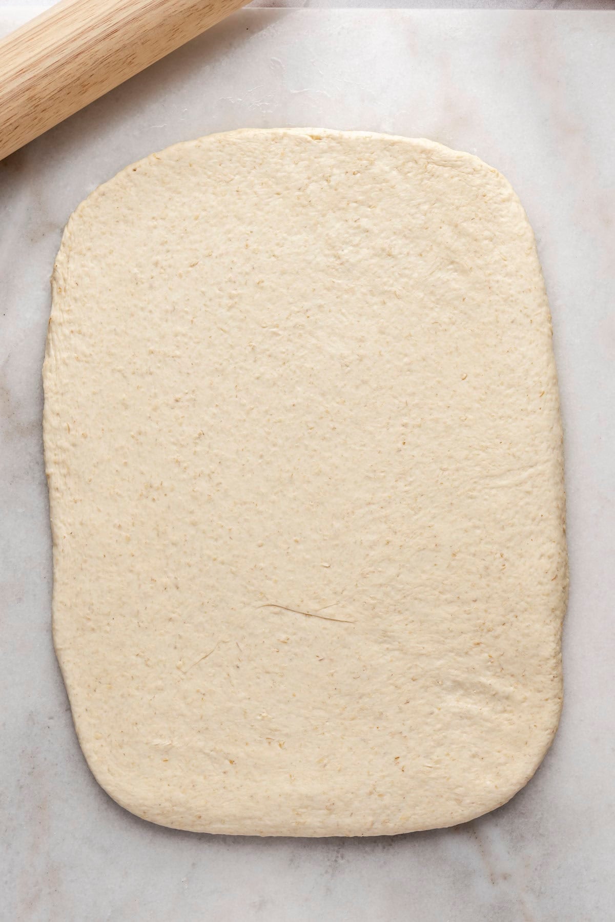 Dough flattened into a 14x10 rectangle.