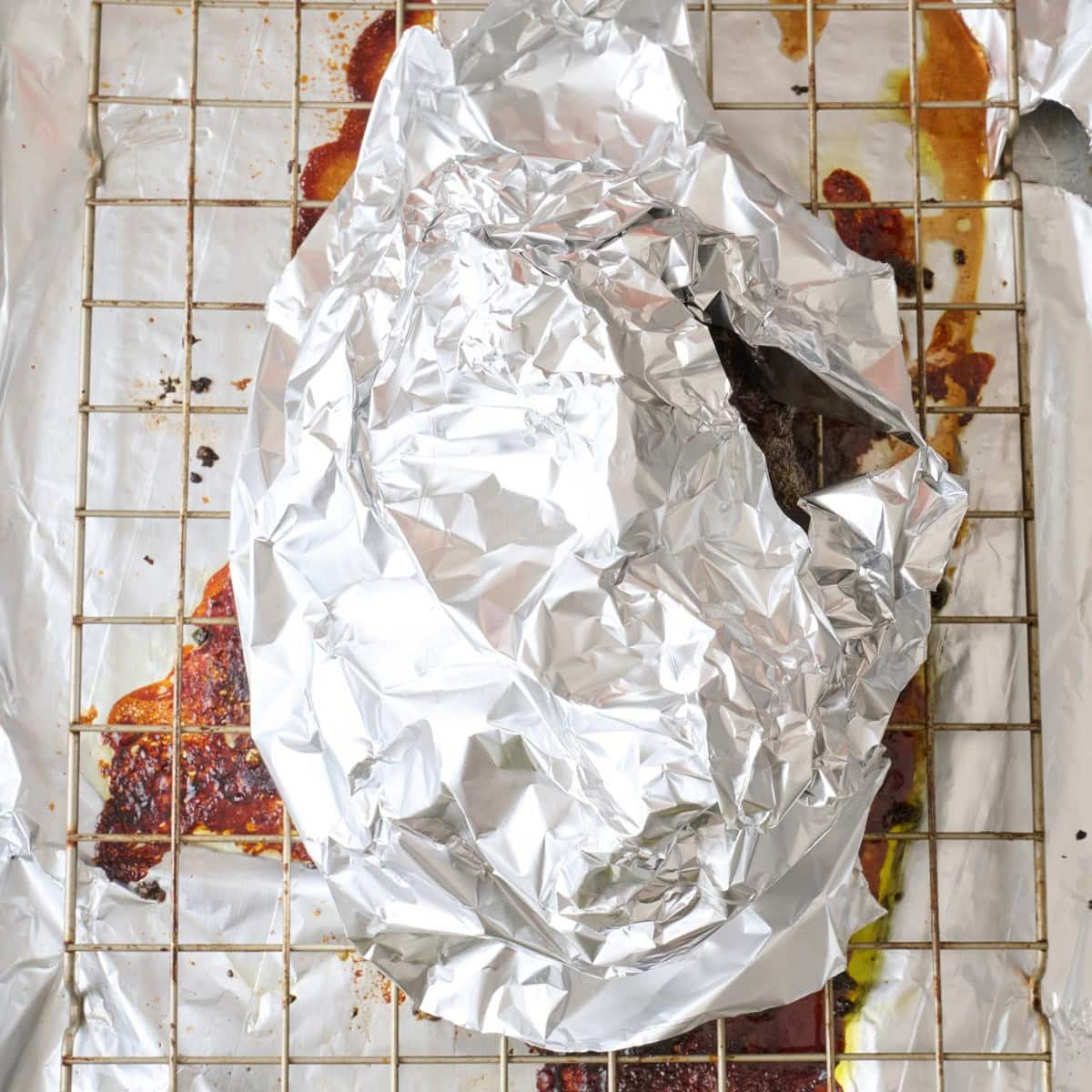 Foil tented around meat after roasting.