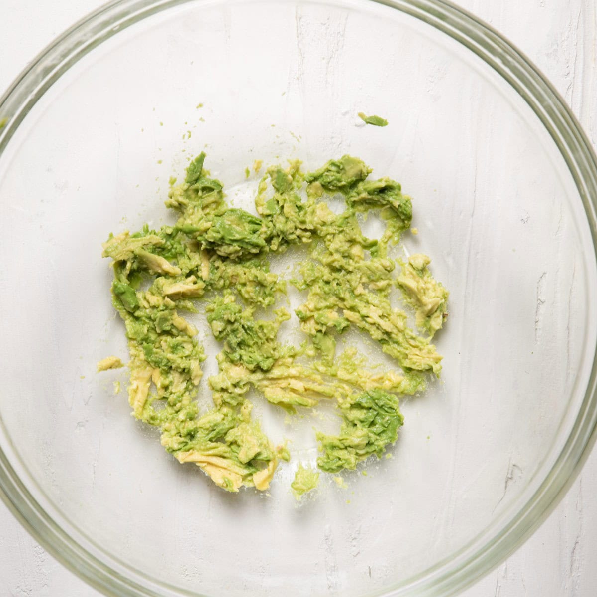 Mashed avocado in a bowl.