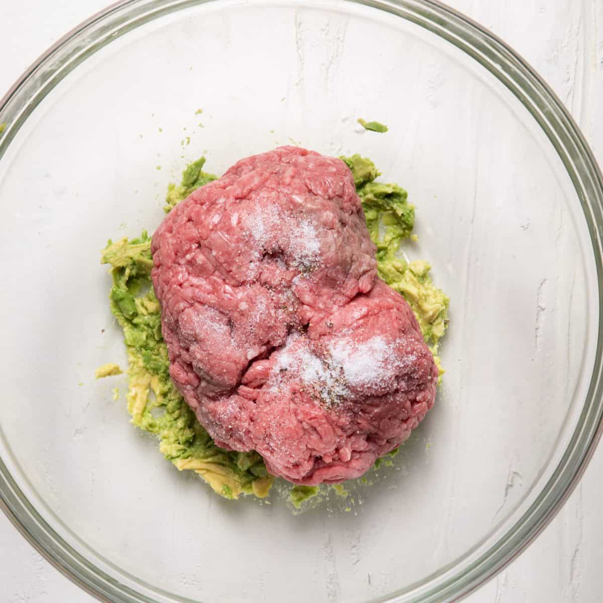 Ground beef, salt and pepper added on top.