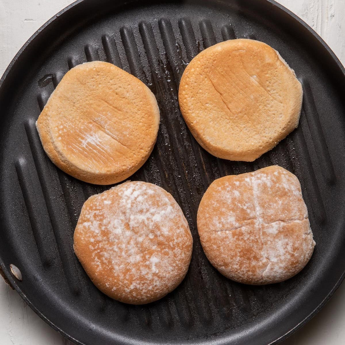 Burger buns on a grill bun.