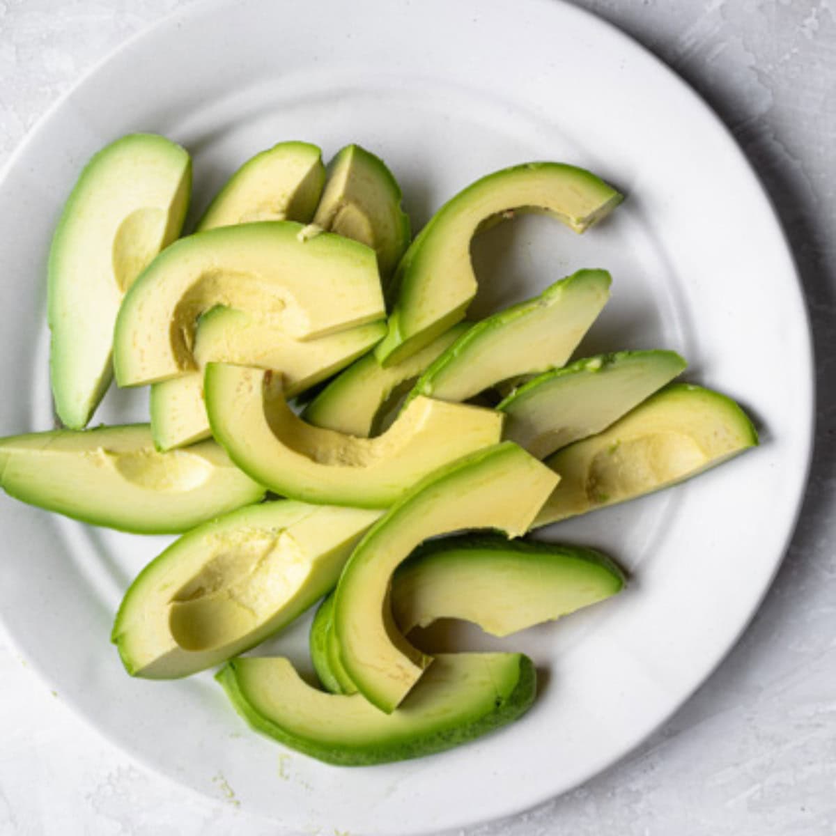 Sliced avocados on a plate.