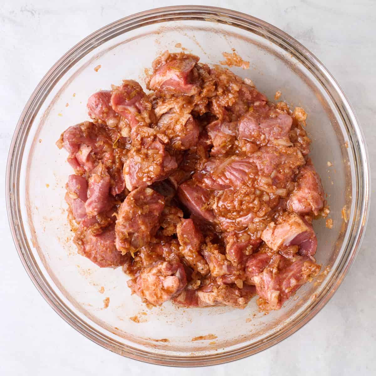 After coating lamb in marinade.