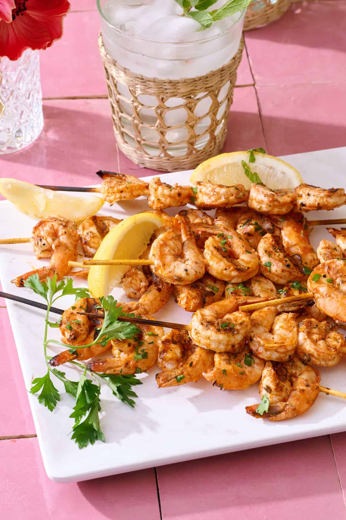 Grilled shrimp skewers on a plate.