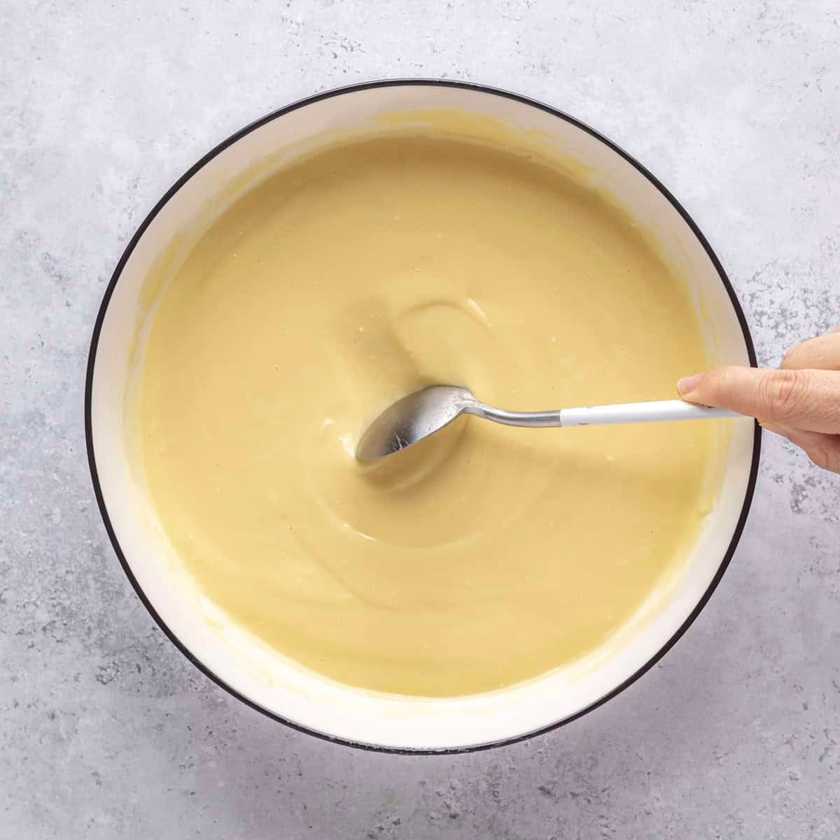 After fully chilled with a spoon scraping off the top to show consistency.