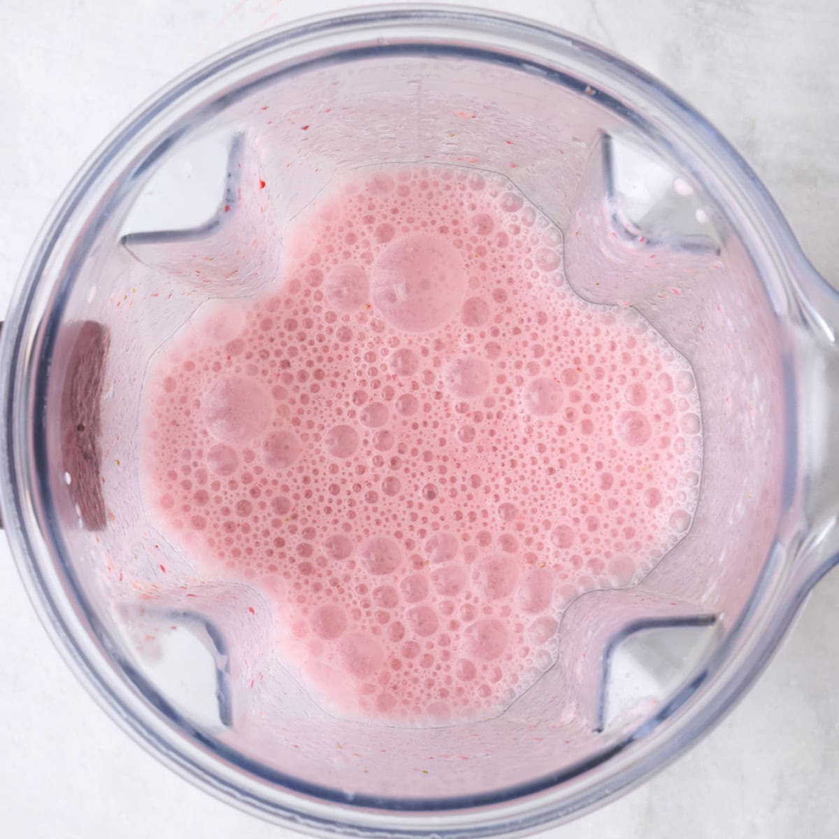 After blending ingredients smooth into a bright pink mixture in blender.
