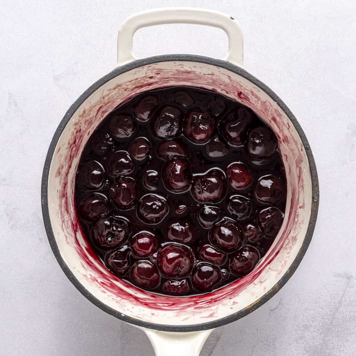 Thick cherry compote in a pot.
