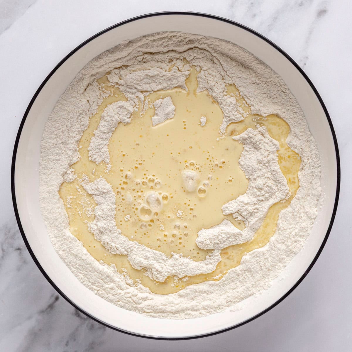 Dry ingredients after combined with egg mixture poured on top.